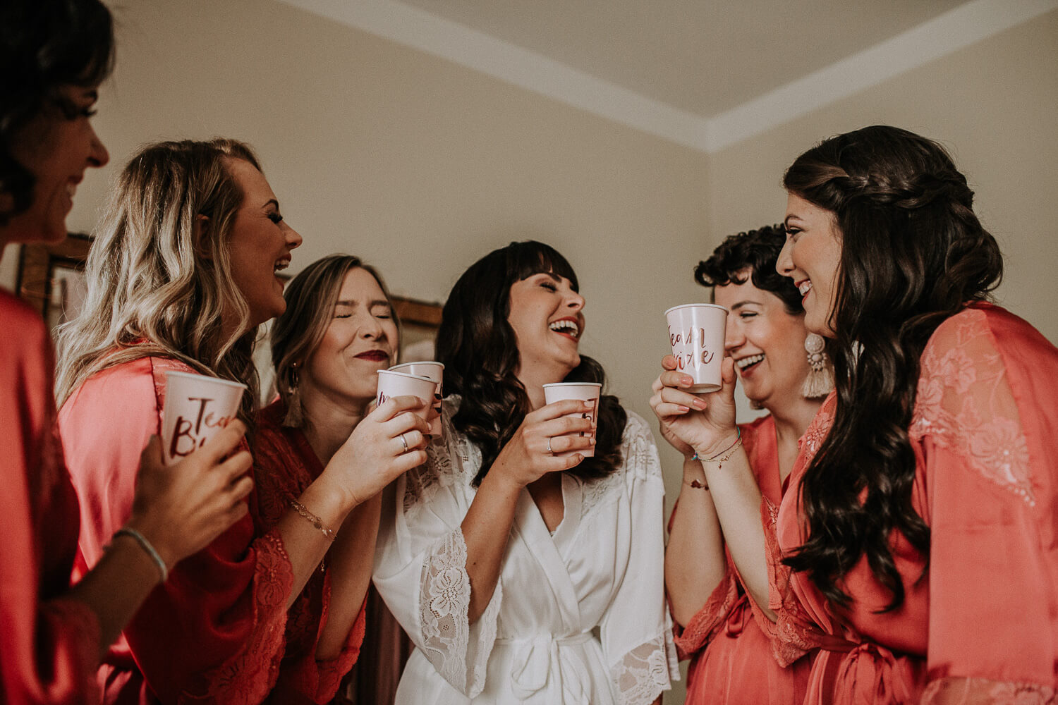 a wonderful happy and emotional moment of the bride with her bridesmaids