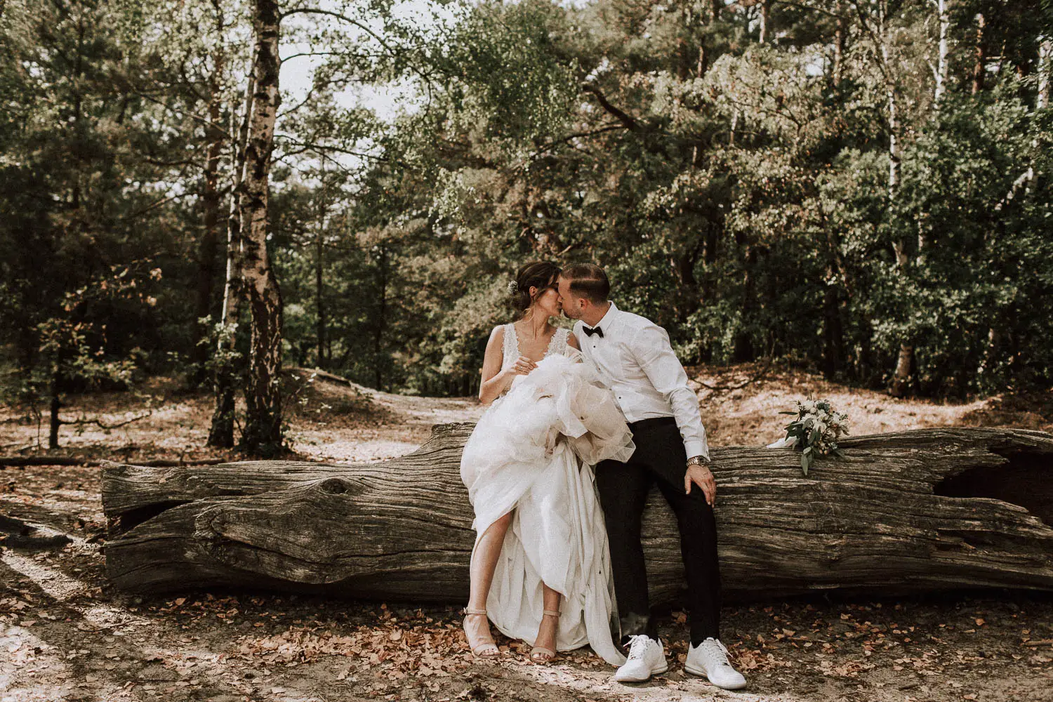 What a beautiful scenery. He kisses slightly her lips, while leaning against a tree trunk. So romantic!